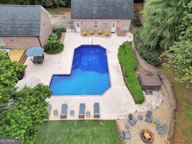 704 Branchview Ct, Mcdonough, GA 30252 - outdoor pool featuring a patio and a fire pit