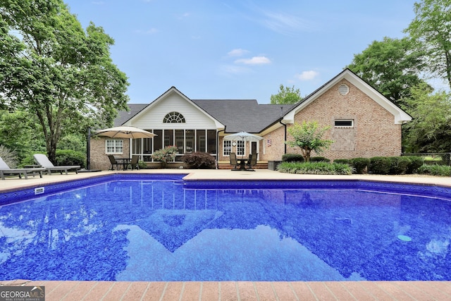 704 Branchview Ct, Mcdonough, GA 30252 - outdoor pool featuring a patio area, a sunroom, and outdoor dining space