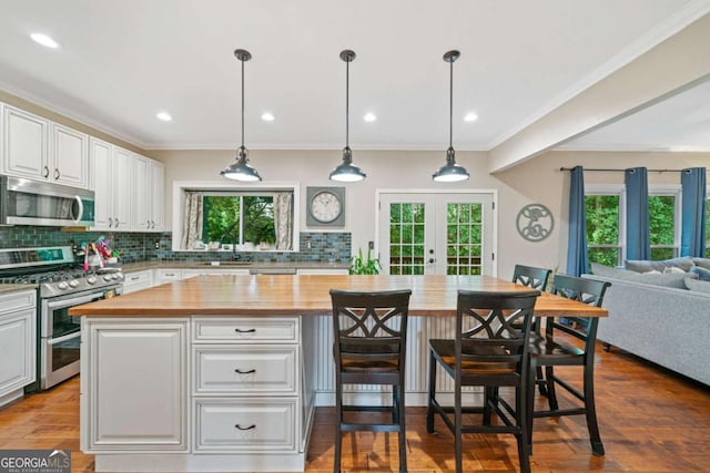 2346 Unicoi Ct, Duluth, GA 30097 - kitchen with wood counters, stainless steel appliances, french doors, white cabinets, and recessed lighting