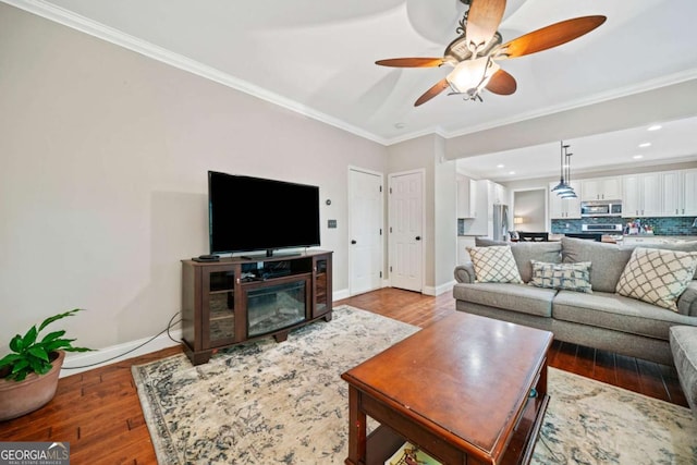 2346 Unicoi Ct, Duluth, GA 30097 - living area with baseboards, wood finished floors, ceiling fan, ornamental molding, and recessed lighting