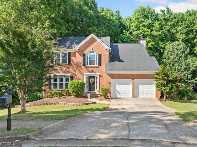 2346 Unicoi Ct, Duluth, GA 30097 - colonial inspired home with an attached garage, concrete driveway, brick siding, a chimney, and roof with shingles