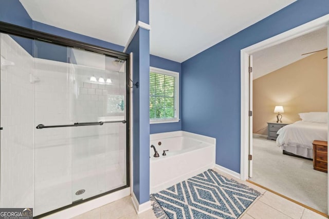 2346 Unicoi Ct, Duluth, GA 30097 - ensuite bathroom with a garden tub, a stall shower, tile patterned floors, baseboards, and lofted ceiling
