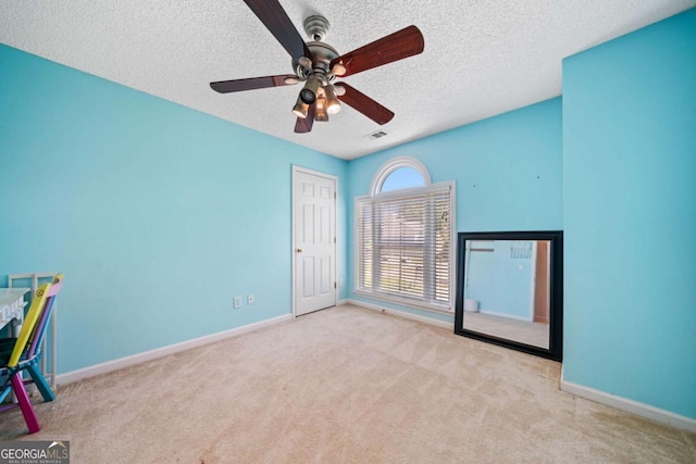 2346 Unicoi Ct, Duluth, GA 30097 - carpeted empty room with a textured ceiling, baseboards, and a ceiling fan