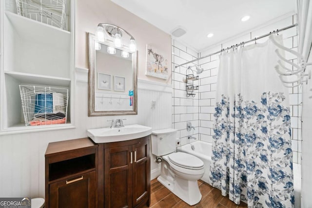 2346 Unicoi Ct, Duluth, GA 30097 - bathroom featuring toilet, wood finished floors, vanity, shower / bath combination with curtain, and a wainscoted wall