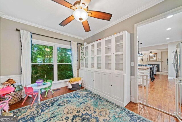 2346 Unicoi Ct, Duluth, GA 30097 - sitting room featuring ceiling fan, ornamental molding, wood finished floors, a fireplace, and recessed lighting
