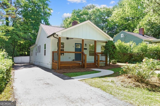 5 Windsor Ter, Avondale Estates, GA 30002 - bungalow-style house with covered porch, a chimney, board and batten siding, and roof with shingles