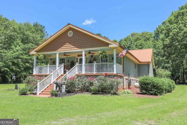 287 Napier Dr, Eatonton, GA 31024 - bungalow with a ceiling fan, a porch, a front lawn, and metal roof