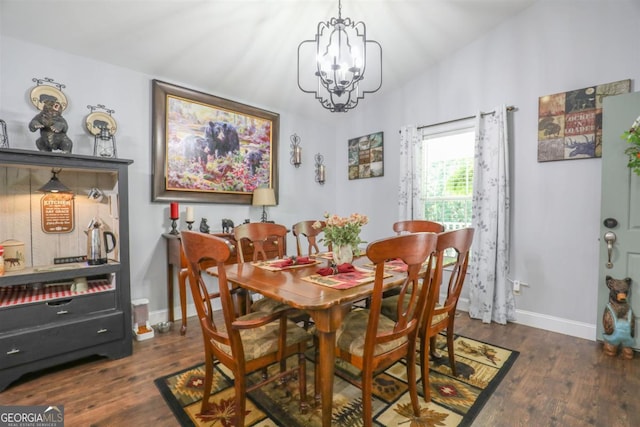 287 Napier Dr, Eatonton, GA 31024 - dining room with a chandelier, wood finished floors, and baseboards