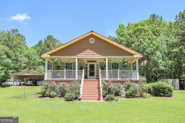 287 Napier Dr, Eatonton, GA 31024 - bungalow featuring ceiling fan, a detached carport, stairway, a porch, and a front yard
