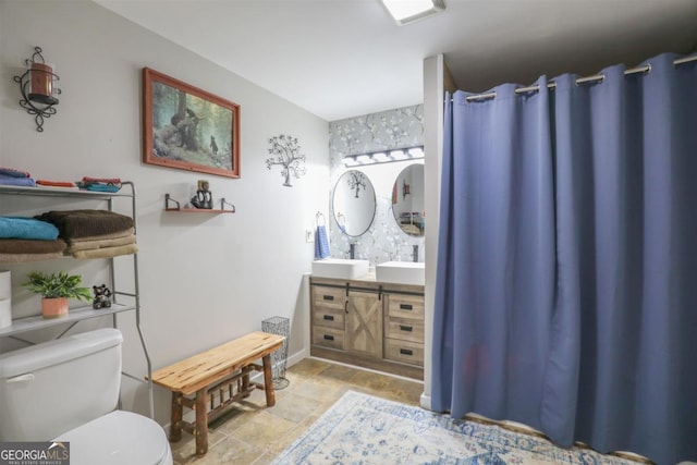 287 Napier Dr, Eatonton, GA 31024 - bathroom featuring double vanity, toilet, and a shower with shower curtain