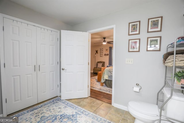 287 Napier Dr, Eatonton, GA 31024 - bathroom with baseboards, toilet, tile patterned flooring, and ceiling fan