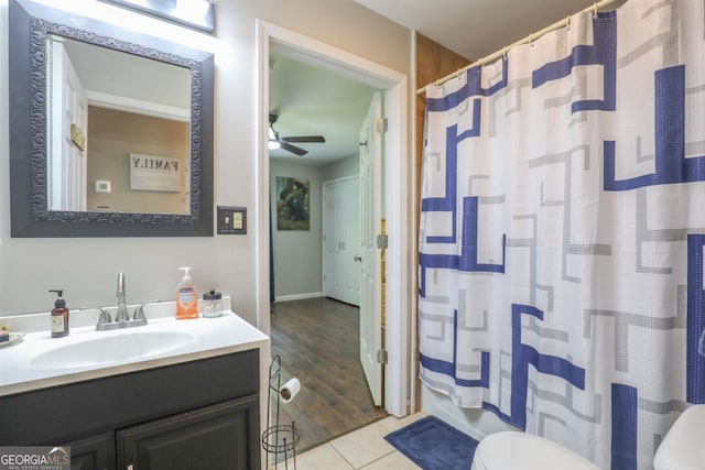 287 Napier Dr, Eatonton, GA 31024 - full bath featuring toilet, vanity, a ceiling fan, curtained shower, and tile patterned floors