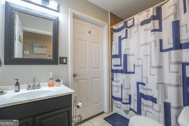 287 Napier Dr, Eatonton, GA 31024 - full bath with toilet, tile patterned floors, vanity, and a shower with shower curtain