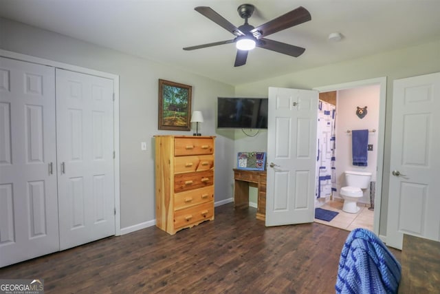 287 Napier Dr, Eatonton, GA 31024 - bedroom with dark wood-type flooring, baseboards, a closet, and connected bathroom