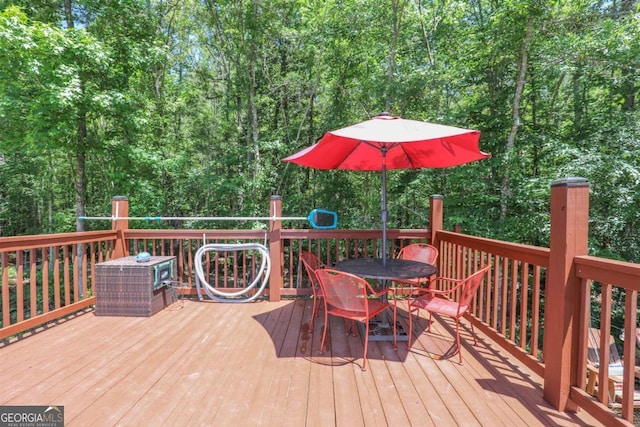 287 Napier Dr, Eatonton, GA 31024 - wooden terrace featuring outdoor dining space