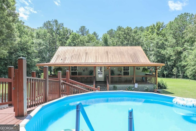 287 Napier Dr, Eatonton, GA 31024 - outdoor pool featuring a lawn and a view of trees
