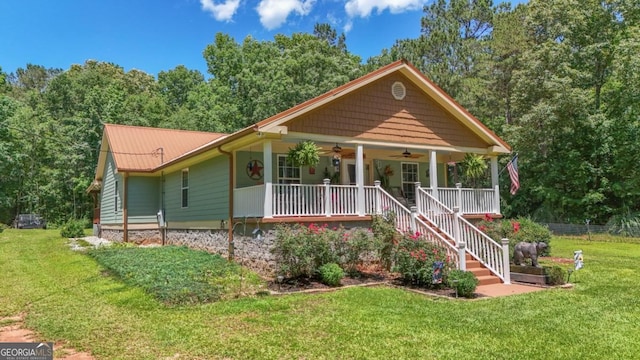 287 Napier Dr, Eatonton, GA 31024 - view of front of property featuring ceiling fan, a porch, a front yard, stairway, and metal roof