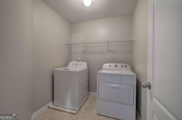 26 Ivey Meadow Dr, Dallas, GA 30132 - laundry room with washing machine and clothes dryer and baseboards