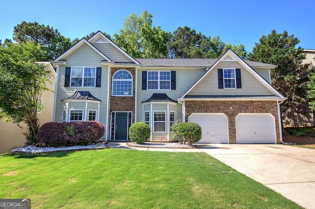 26 Ivey Meadow Dr, Dallas, GA 30132 - view of front facade with driveway, a front yard, and stone siding