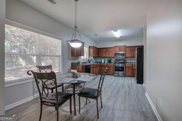 26 Ivey Meadow Dr, Dallas, GA 30132 - dining area with light wood-style floors and baseboards