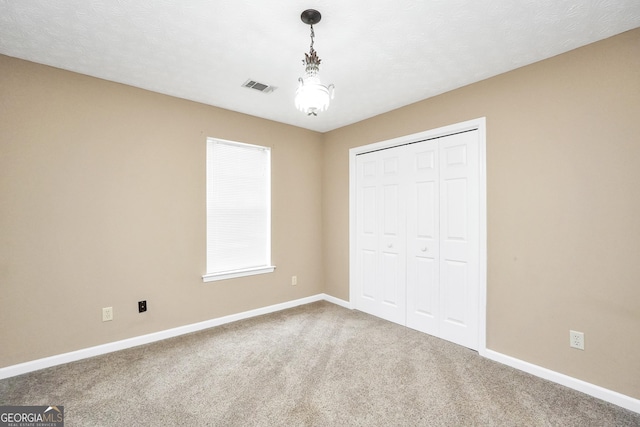 130 Nicki Ct, Hampton, GA 30228 - unfurnished bedroom with carpet flooring, baseboards, and a closet