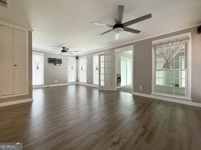 712 Boy Scout Rd, Newnan, GA 30263 - unfurnished living room with a ceiling fan, dark wood-style floors, baseboards, and crown molding