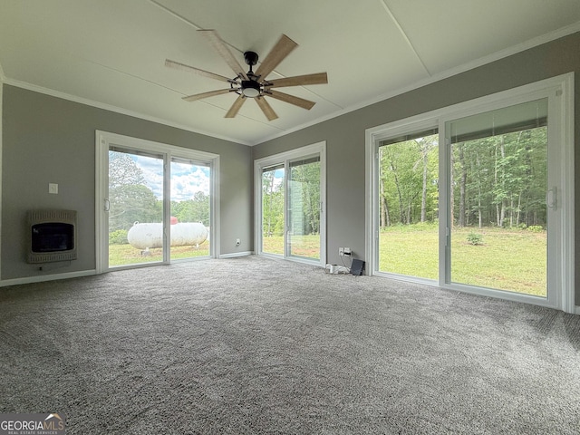 712 Boy Scout Rd, Newnan, GA 30263 - unfurnished living room with heating unit, crown molding, ceiling fan, carpet flooring, and baseboards