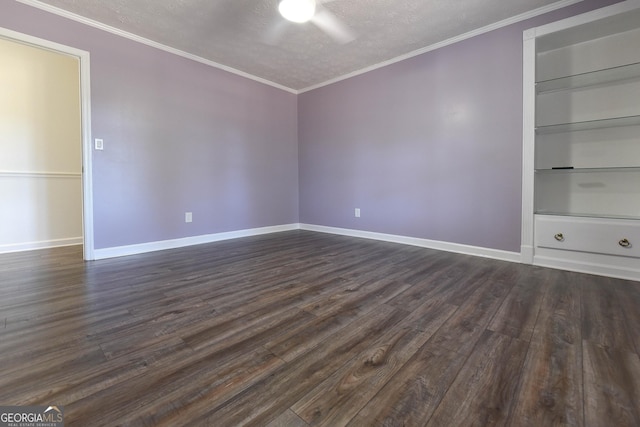 712 Boy Scout Rd, Newnan, GA 30263 - unfurnished room with a textured ceiling, dark wood finished floors, baseboards, crown molding, and built in shelves