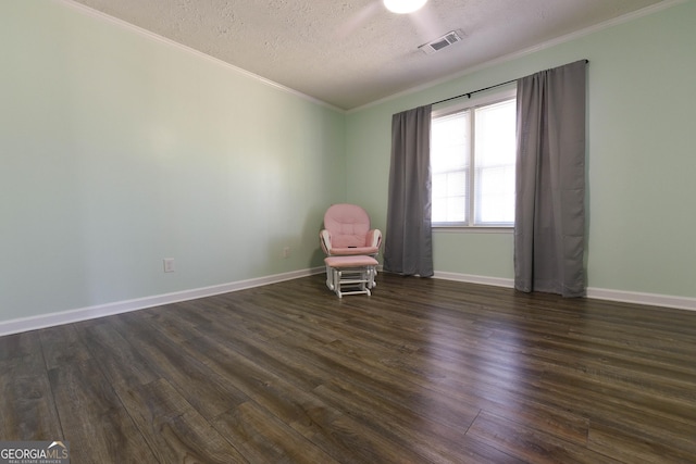 712 Boy Scout Rd, Newnan, GA 30263 - unfurnished room with ornamental molding, dark wood-type flooring, a textured ceiling, and baseboards