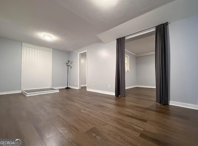 712 Boy Scout Rd, Newnan, GA 30263 - spare room featuring dark wood-type flooring and baseboards