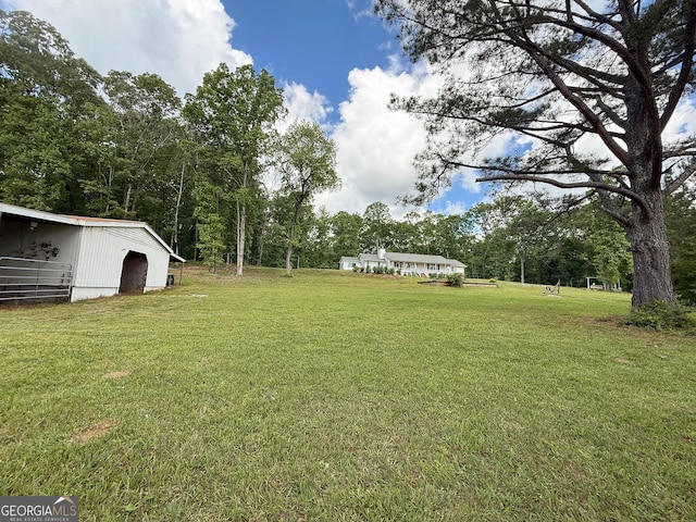 712 Boy Scout Rd, Newnan, GA 30263 - view of green lawn with a pole building and an outdoor structure