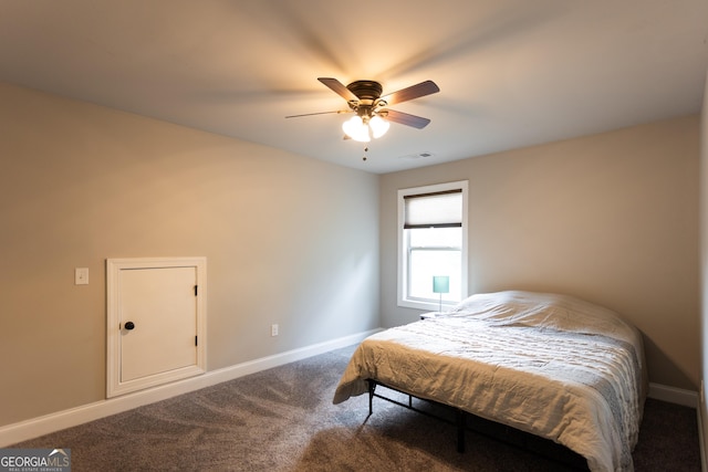 632 Creekside Trce, Covington, GA 30014 - bedroom featuring baseboards, dark colored carpet, and a ceiling fan