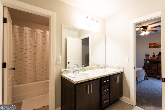 632 Creekside Trce, Covington, GA 30014 - ensuite bathroom with double vanity, shower / bathtub combination with curtain, and a ceiling fan