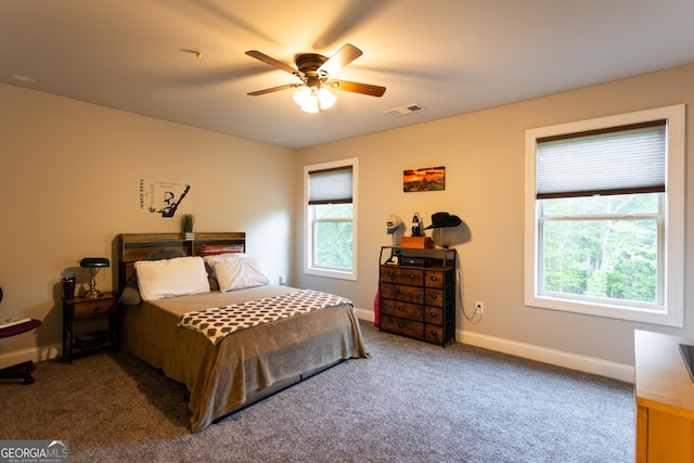632 Creekside Trce, Covington, GA 30014 - bedroom featuring multiple windows, carpet flooring, and baseboards