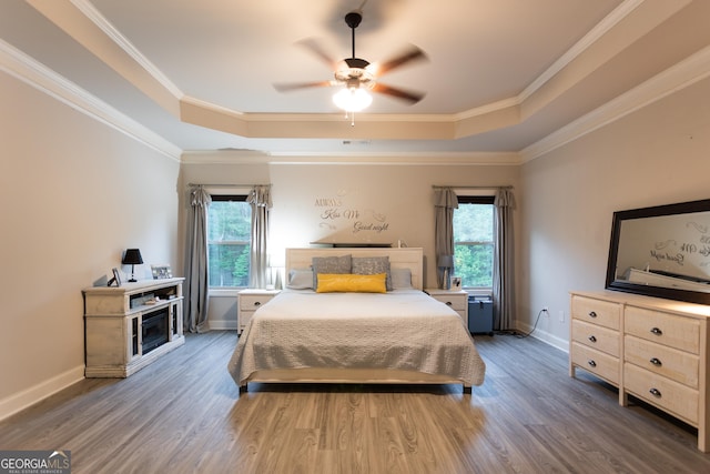 632 Creekside Trce, Covington, GA 30014 - bedroom with a tray ceiling, wood finished floors, baseboards, ornamental molding, and ceiling fan