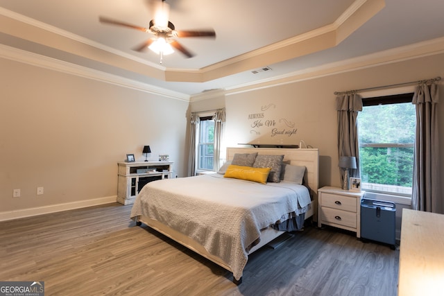 632 Creekside Trce, Covington, GA 30014 - bedroom with a raised ceiling, wood finished floors, ornamental molding, a ceiling fan, and baseboards