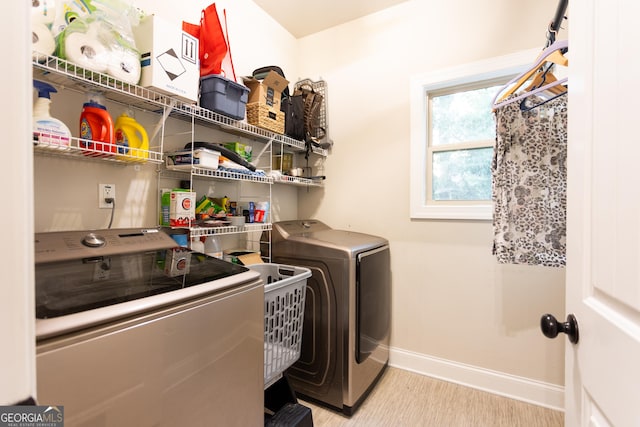 632 Creekside Trce, Covington, GA 30014 - washroom featuring washer and clothes dryer and baseboards