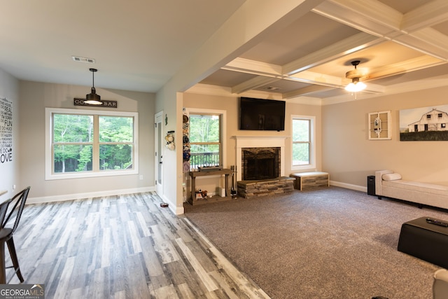 632 Creekside Trce, Covington, GA 30014 - unfurnished living room featuring baseboards, coffered ceiling, beamed ceiling, a fireplace, and a ceiling fan