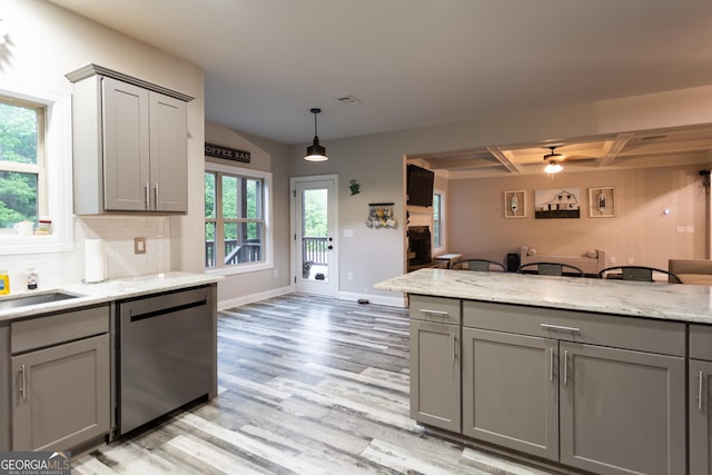 632 Creekside Trce, Covington, GA 30014 - kitchen with dishwasher, gray cabinets, light wood-style floors, baseboards, and backsplash