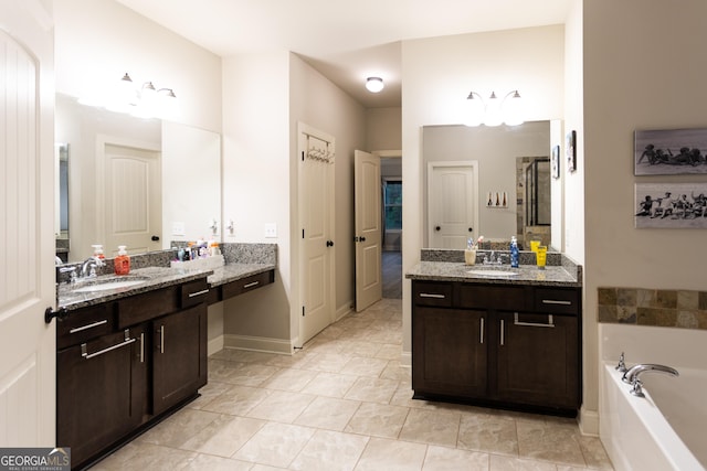632 Creekside Trce, Covington, GA 30014 - full bath featuring a garden tub, two vanities, baseboards, and an enclosed shower