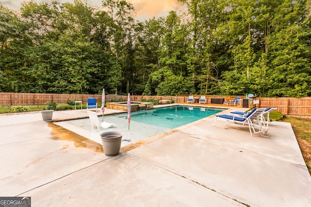 632 Creekside Trce, Covington, GA 30014 - view of swimming pool with a patio, a fenced backyard, and a pool with connected hot tub