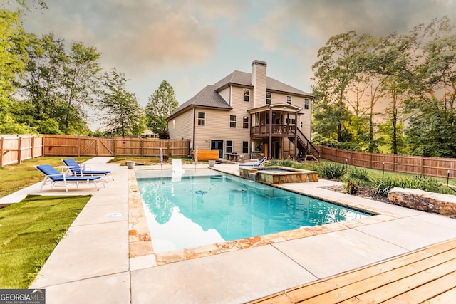 632 Creekside Trce, Covington, GA 30014 - view of swimming pool with a patio, a sunroom, stairs, a pool with connected hot tub, and a deck