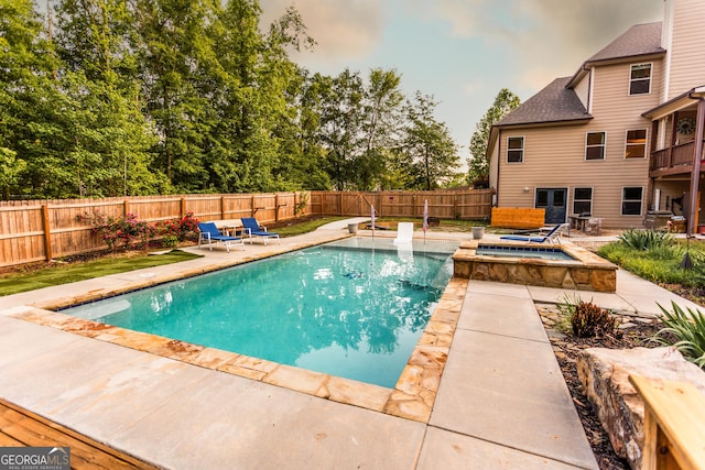 632 Creekside Trce, Covington, GA 30014 - view of swimming pool featuring a patio, an in-ground hot tub, a fenced backyard, and a diving board