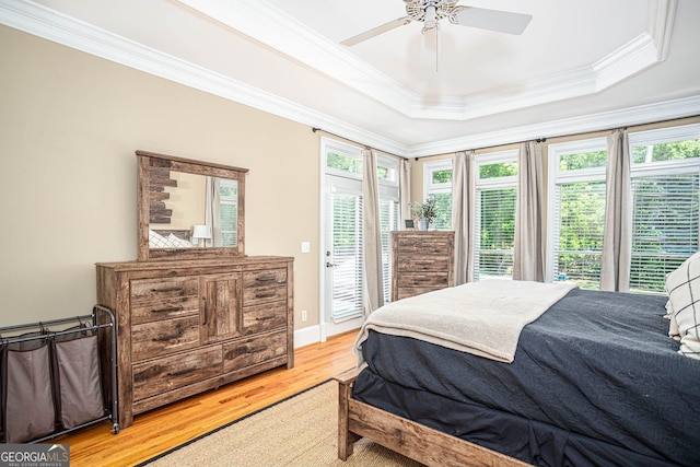 395 Grove Ridge Dr, Loganville, GA 30052 - bedroom with ornamental molding, light wood finished floors, access to outside, a raised ceiling, and ceiling fan