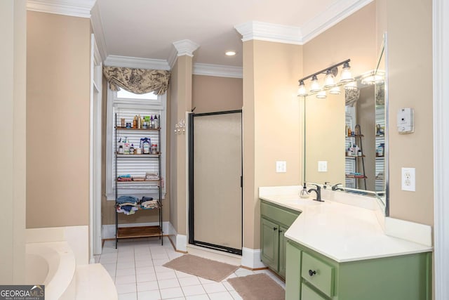 395 Grove Ridge Dr, Loganville, GA 30052 - bathroom featuring tile patterned floors, crown molding, vanity, a stall shower, and a garden tub
