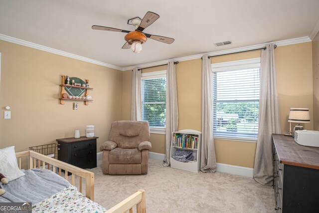 395 Grove Ridge Dr, Loganville, GA 30052 - bedroom with a nursery area, light colored carpet, ornamental molding, and ceiling fan