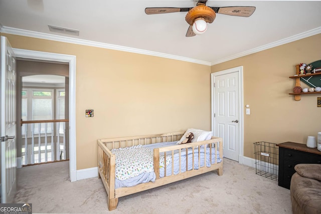 395 Grove Ridge Dr, Loganville, GA 30052 - bedroom featuring ornamental molding, baseboards, carpet floors, arched walkways, and a ceiling fan