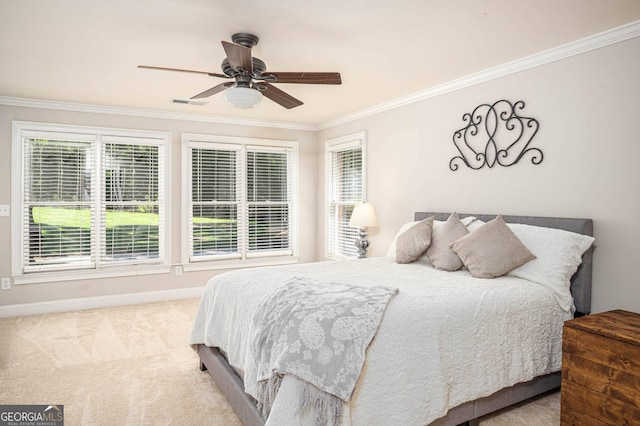 395 Grove Ridge Dr, Loganville, GA 30052 - carpeted bedroom with ornamental molding, baseboards, and ceiling fan