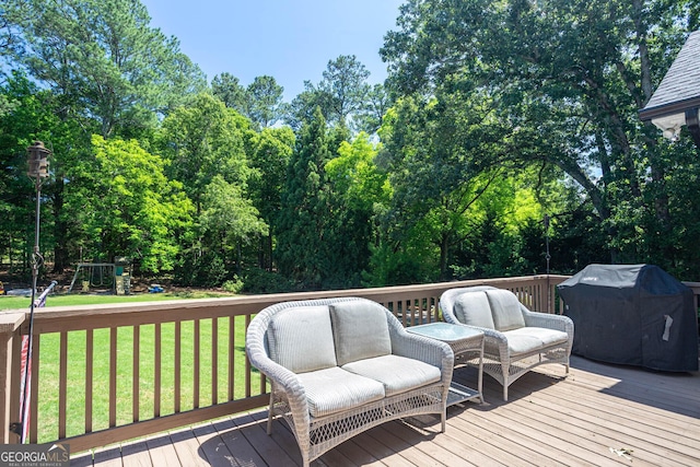 395 Grove Ridge Dr, Loganville, GA 30052 - wooden terrace with area for grilling, a lawn, view of scattered trees, a playground, and outdoor lounge area