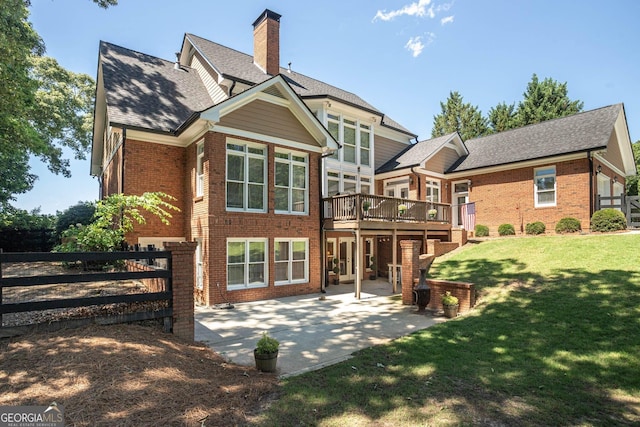 395 Grove Ridge Dr, Loganville, GA 30052 - back of property with brick siding, a deck, a patio, and a shingled roof